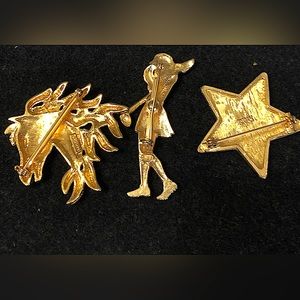 Three beautiful golden brooches